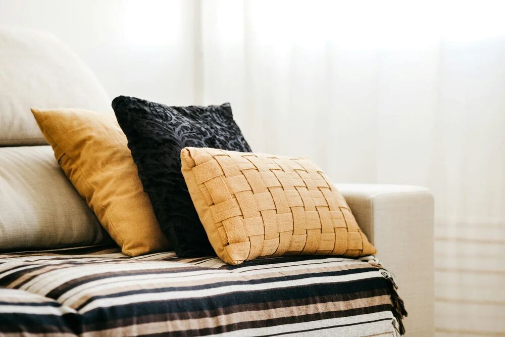 Bright staged living room with carefully arranged furniture and styling